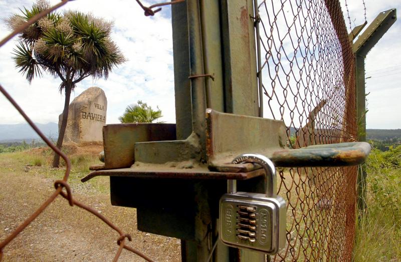 his file photo taken on November 22, 2004 shows the locked gate of the former entrance to Villa Baviera - formerly known as Colonia Dignidad (Dignity Colony), some 350 km south of Santiago.jpg