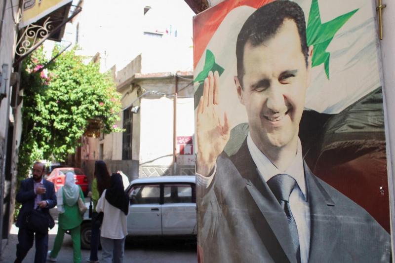Beşar  Esat'ın Şam sokaklarındaki bir posteri. Fotoğraf-Reuters.jpg